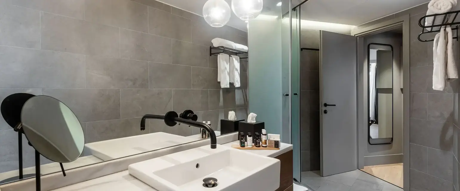 a bathroom with a sink and a shower