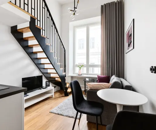 a room with a staircase and couch