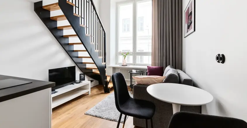 a room with a staircase and couch