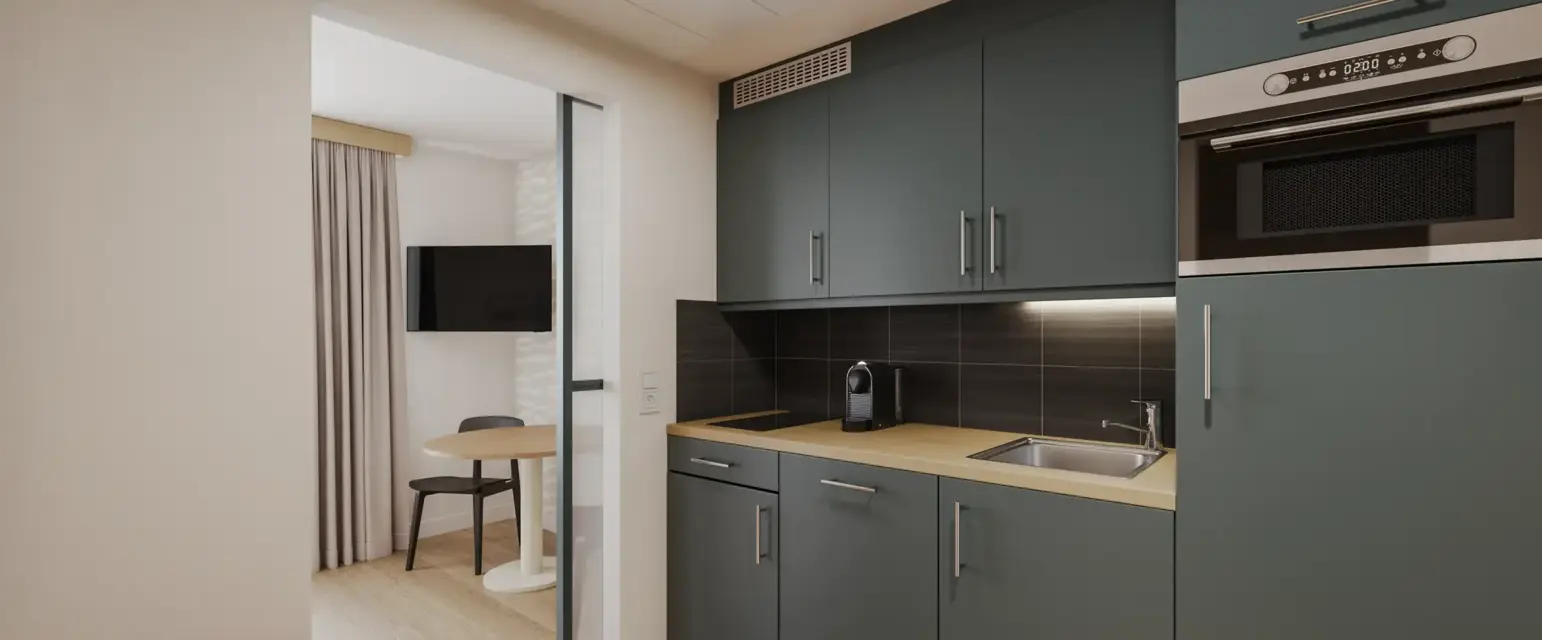 a kitchen with a table and a microwave