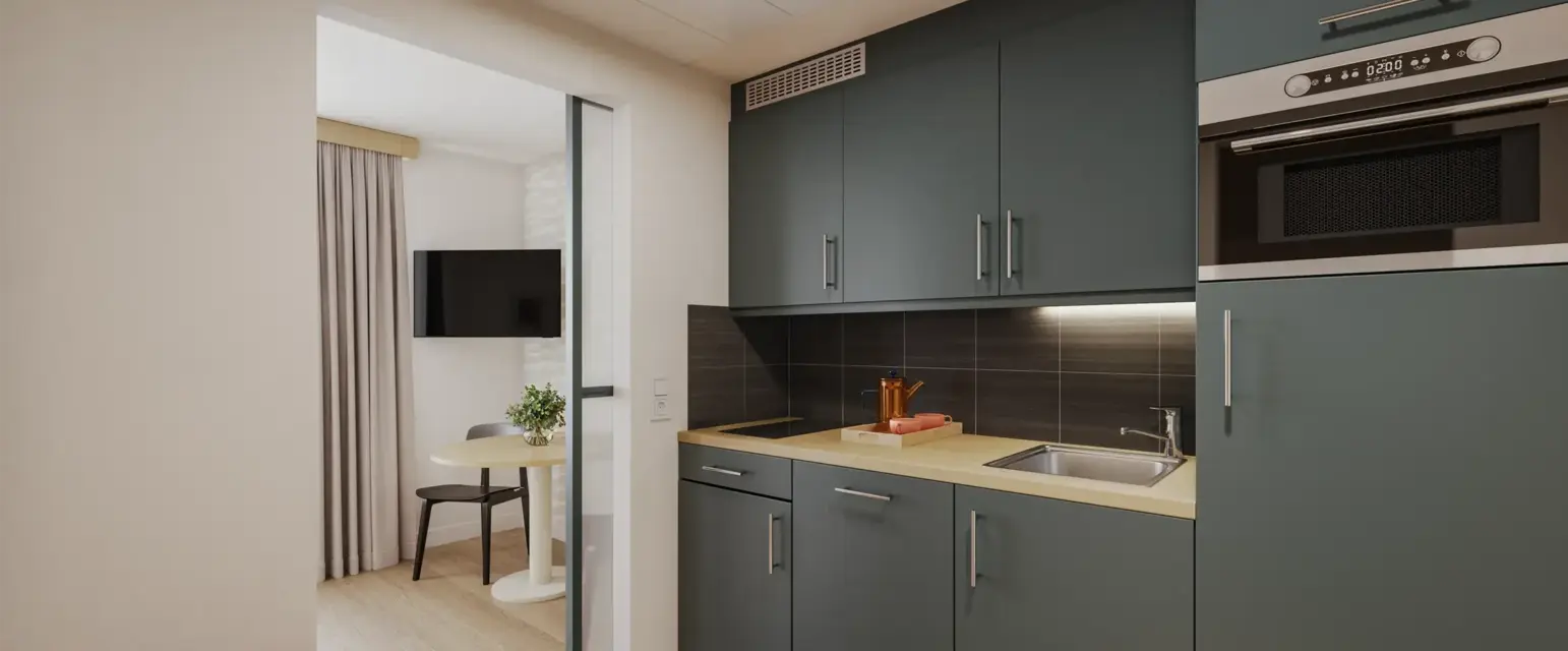 a kitchen with a table and a microwave