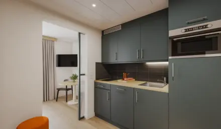 a kitchen with a table and a microwave