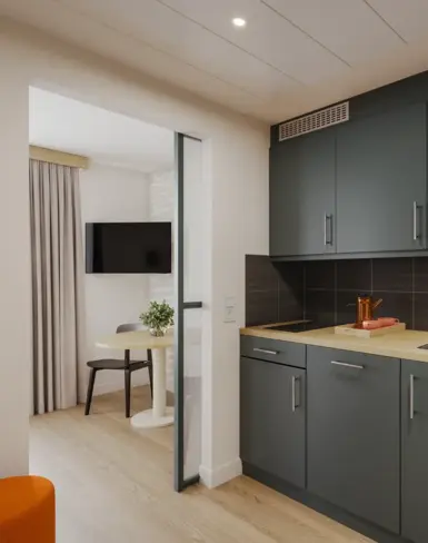 a kitchen with a table and a microwave