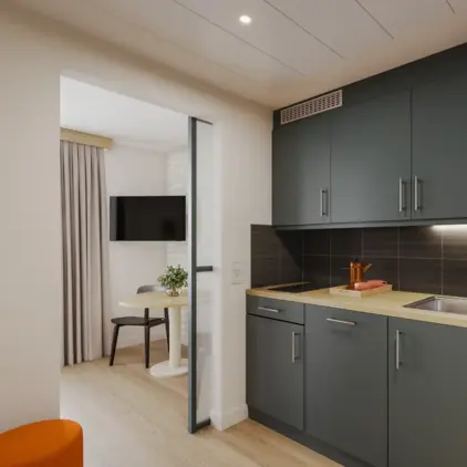 a kitchen with a table and a microwave