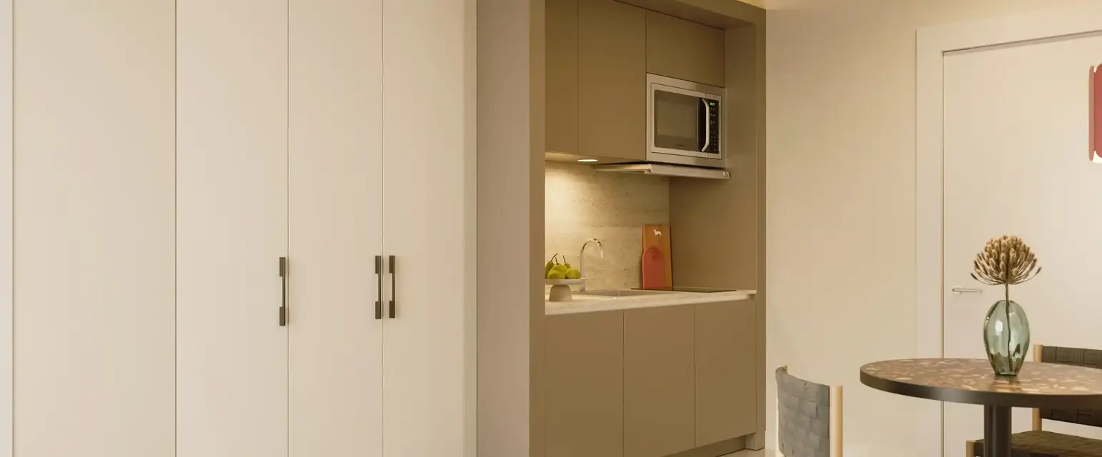 a kitchen with a microwave oven and cabinets