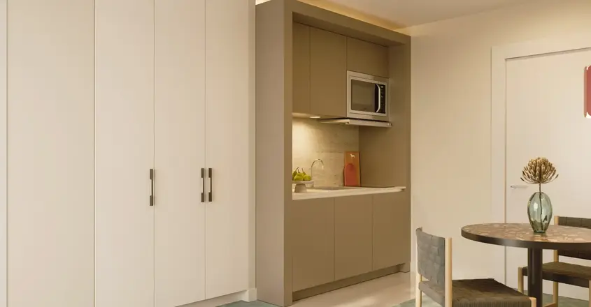 a kitchen with a microwave oven and cabinets
