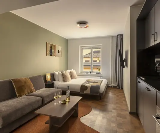 a room with a couch and a bed