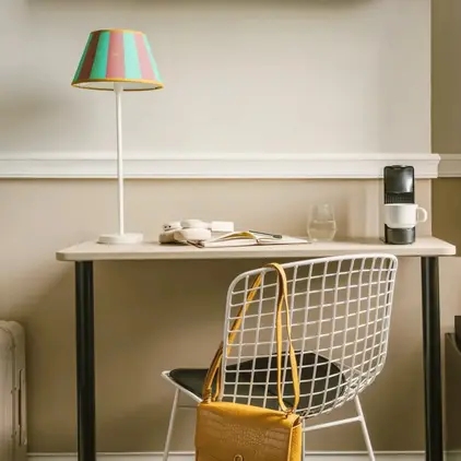 a chair and a lamp in a room