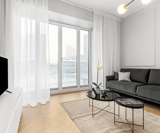 a living room with a couch and coffee table