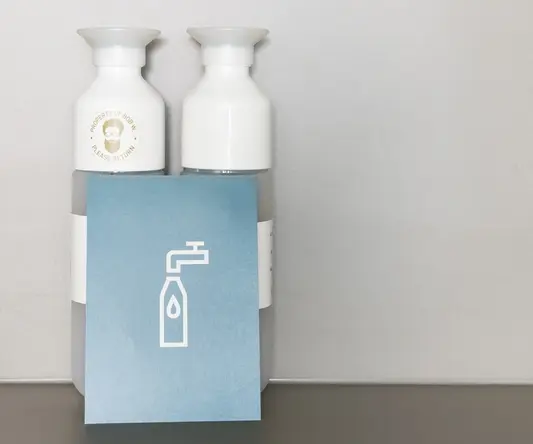 a group of bottles with a blue sign