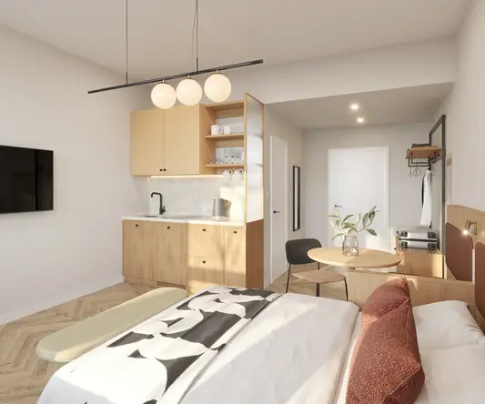 a bedroom with a kitchen and dining area