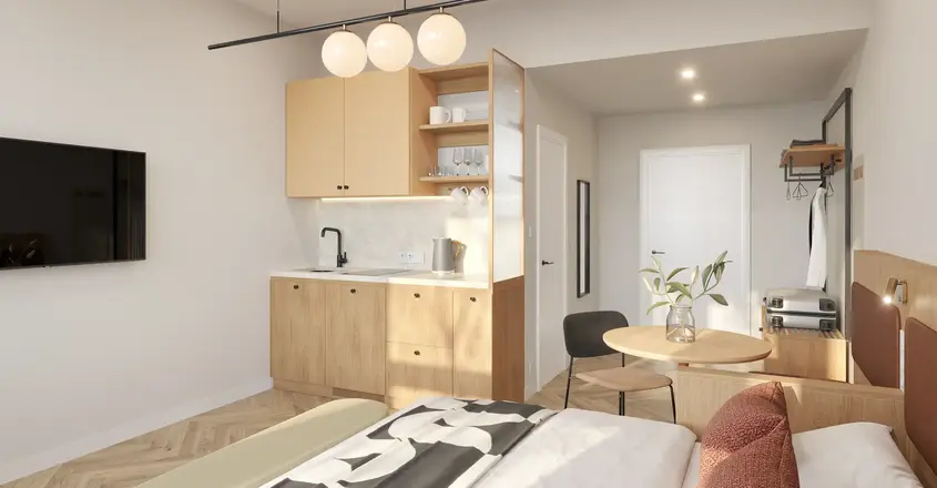 a bedroom with a kitchen and dining area