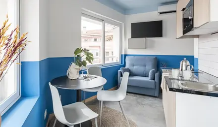 a room with a table and chairs