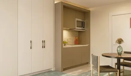 a kitchen with a microwave oven and cabinets