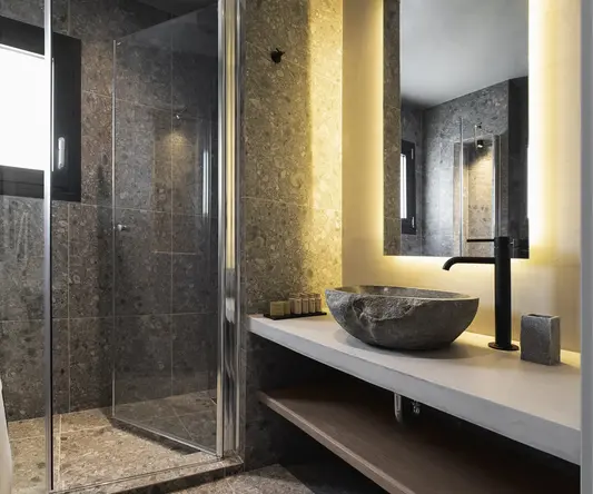 a bathroom with a sink and shower