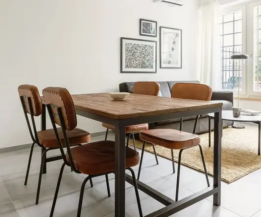 a dining table and chairs in a room