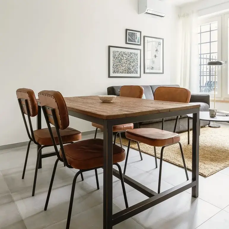 a dining table and chairs in a room