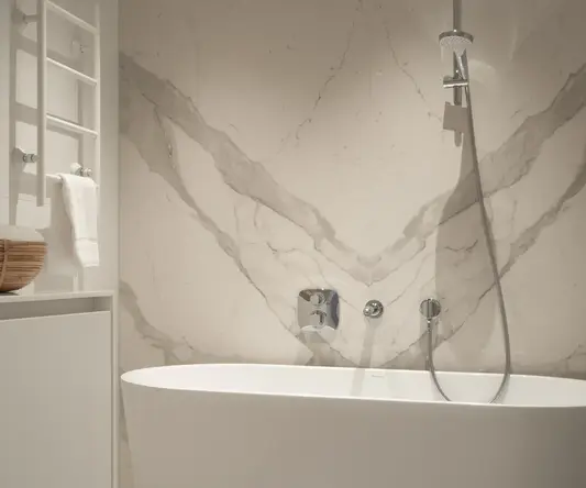 a white bathtub in a bathroom