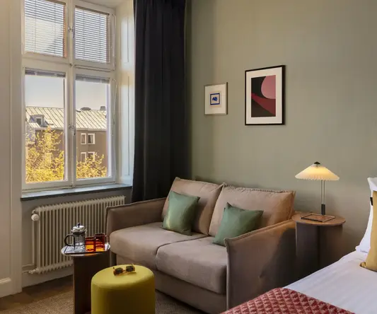 a room with a couch and a bed