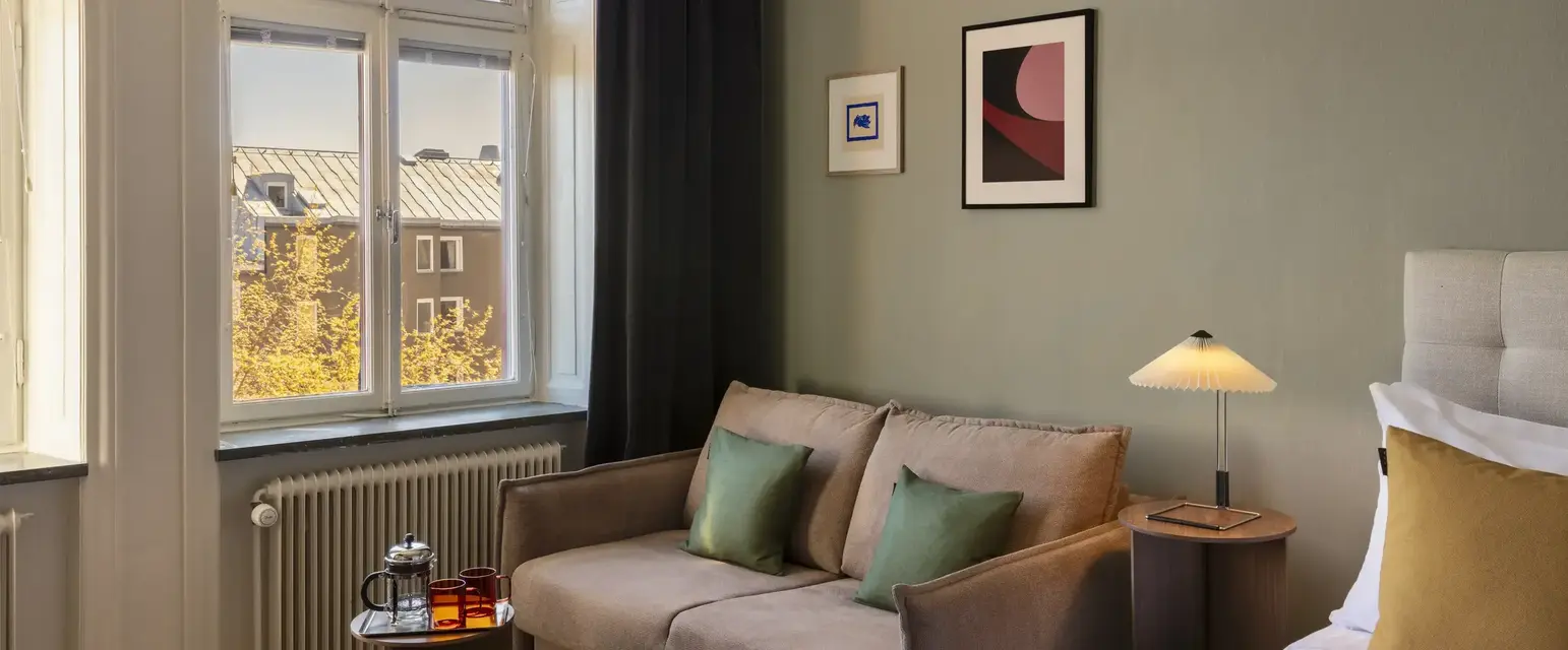 a room with a couch and a bed
