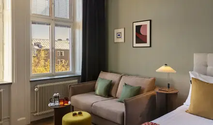 a room with a couch and a bed