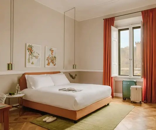 a bedroom with a bed and orange curtains