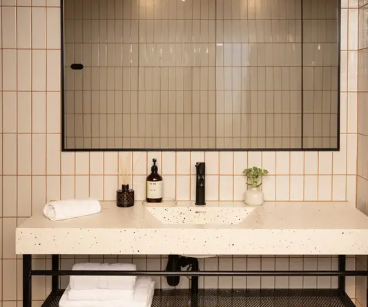 a bathroom with a mirror and sink