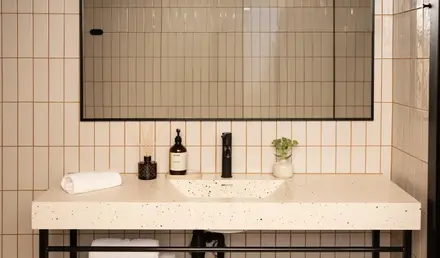 a bathroom with a mirror and sink