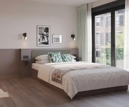 a bedroom with a bed and chair