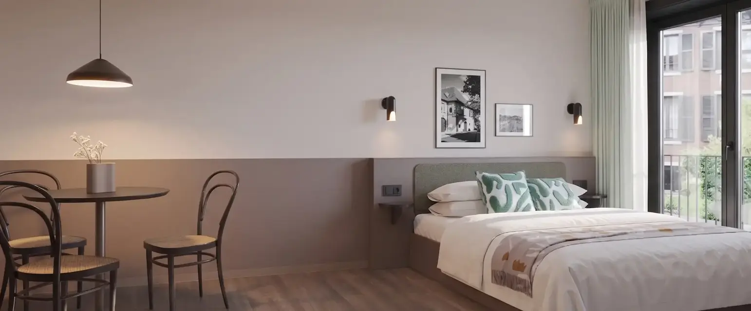 a bedroom with a bed and chair