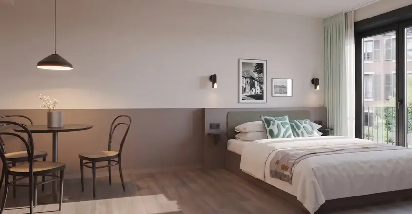a bedroom with a bed and chair