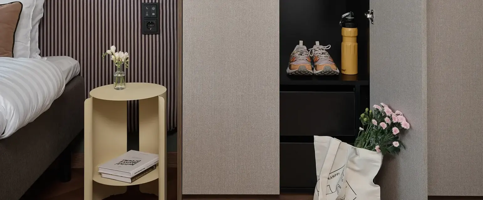 a closet with clothes and shoes in it