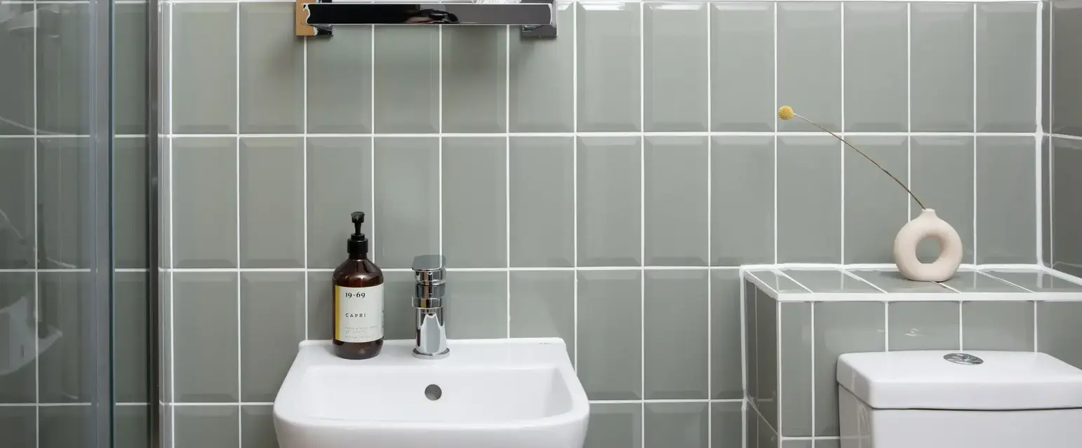 a bathroom with a mirror and sink