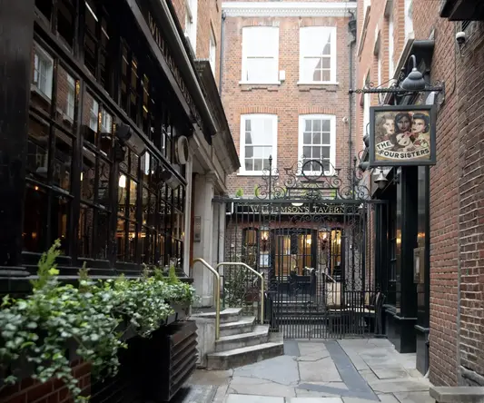 a brick building with a gate