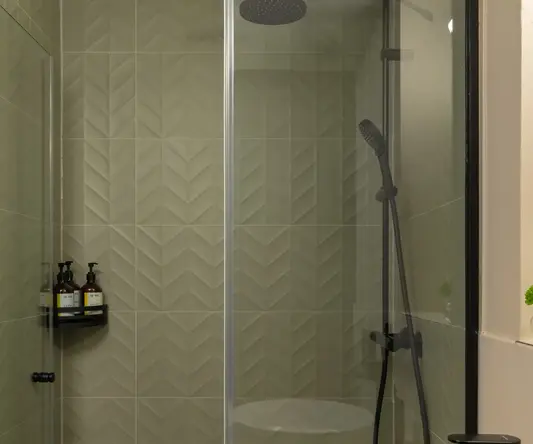 a bathroom with a sink and shower