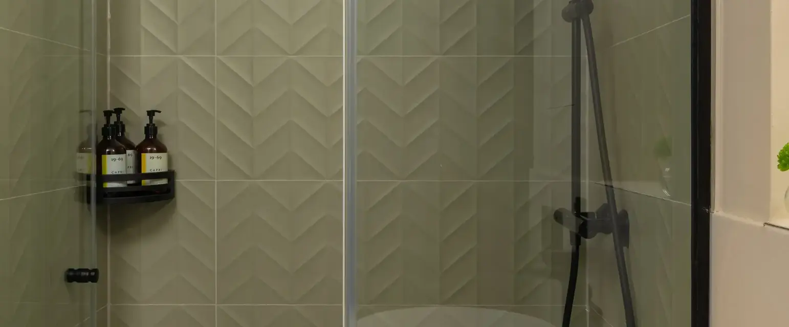 a bathroom with a sink and shower