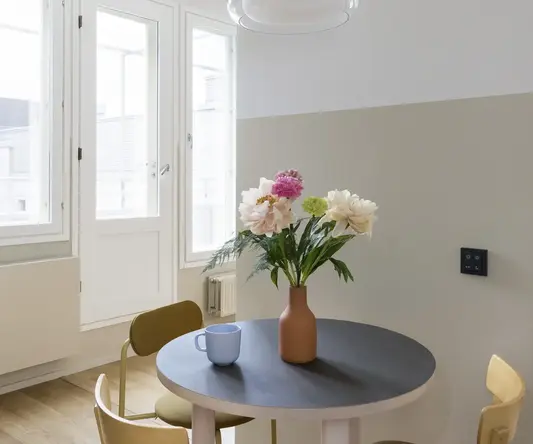 a table with flowers and cups on it