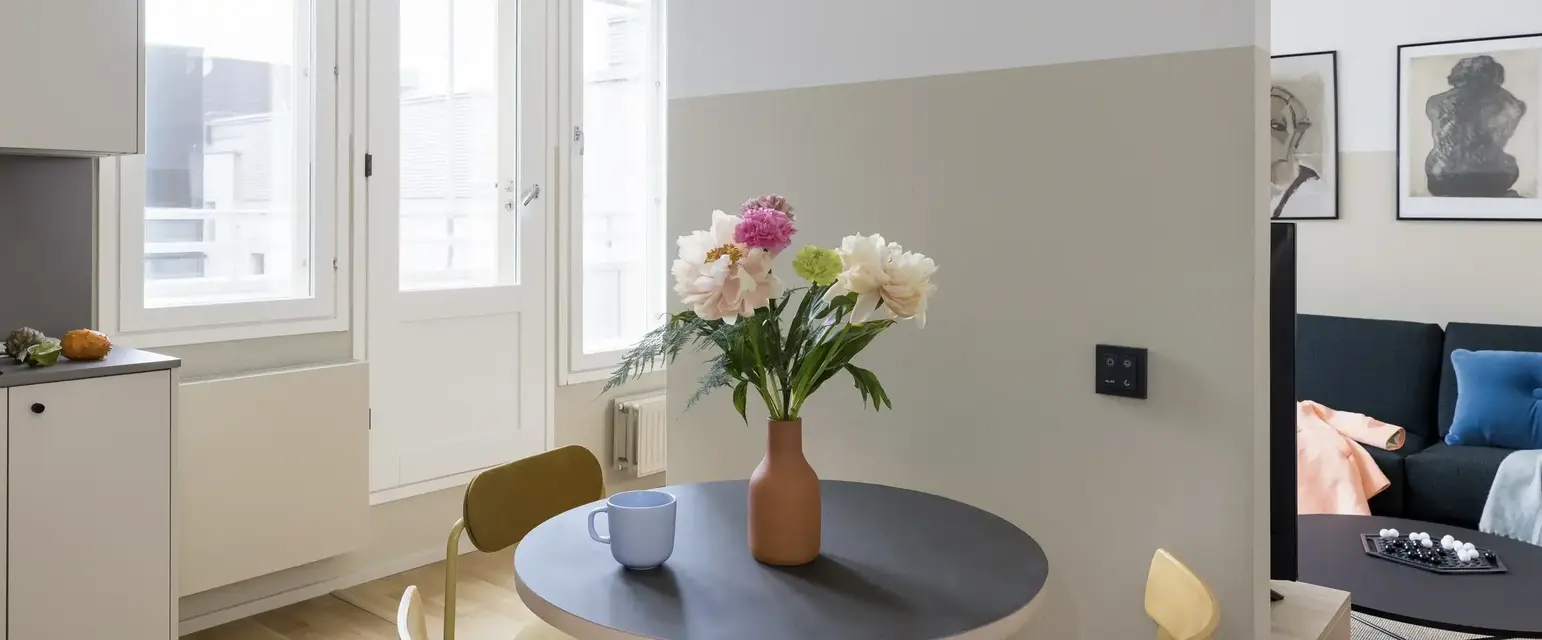 a table with flowers and cups on it