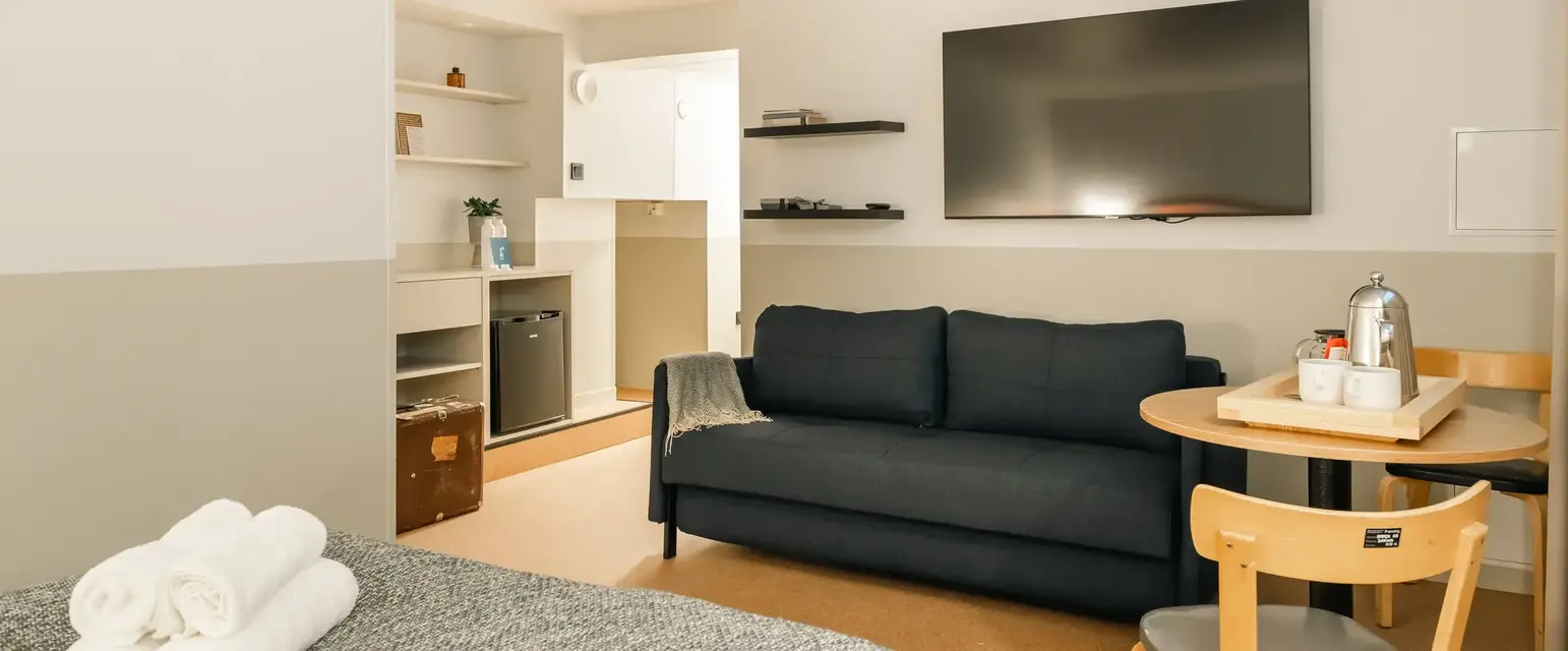 a room with a couch and tv