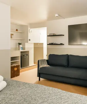 a room with a couch and tv