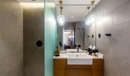 a bathroom with a mirror and sink