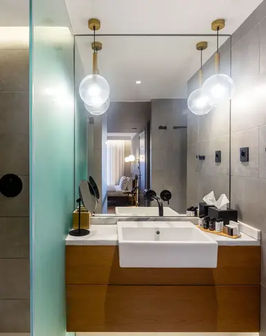 a bathroom with a mirror and sink