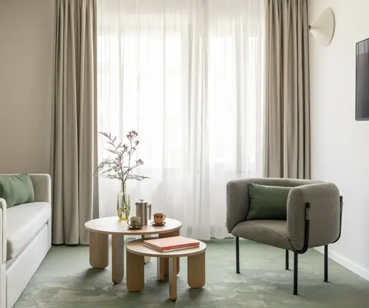 a room with couches and coffee tables