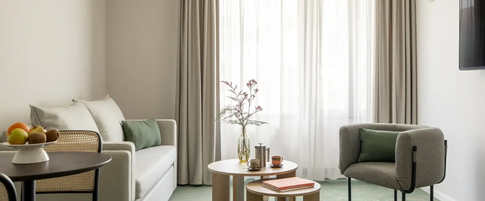 a room with couches and coffee tables