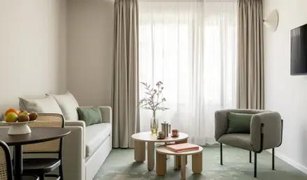 a room with couches and coffee tables