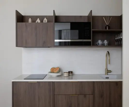 a kitchen with a microwave and a sink