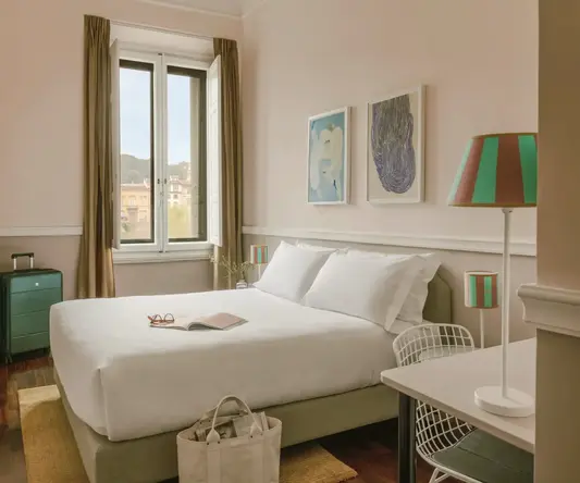 a bedroom with a bed and a desk