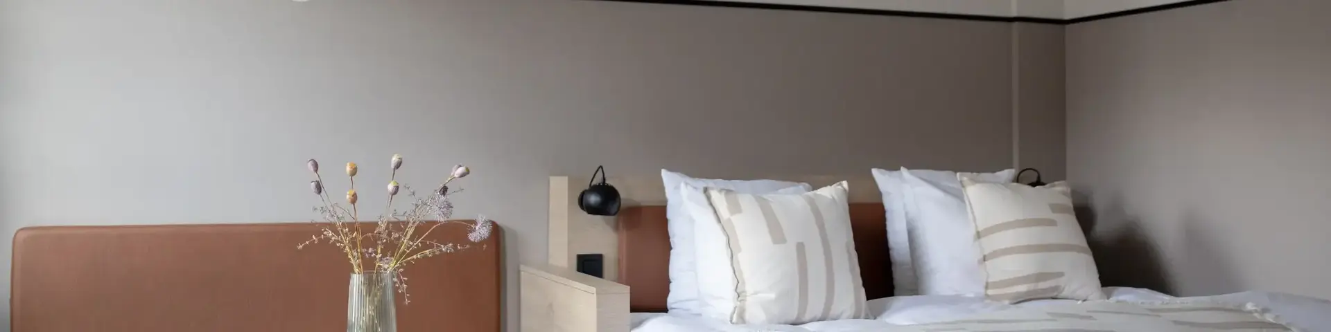 a bed with a table and chairs