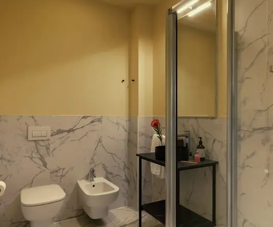 a bathroom with a glass shower door