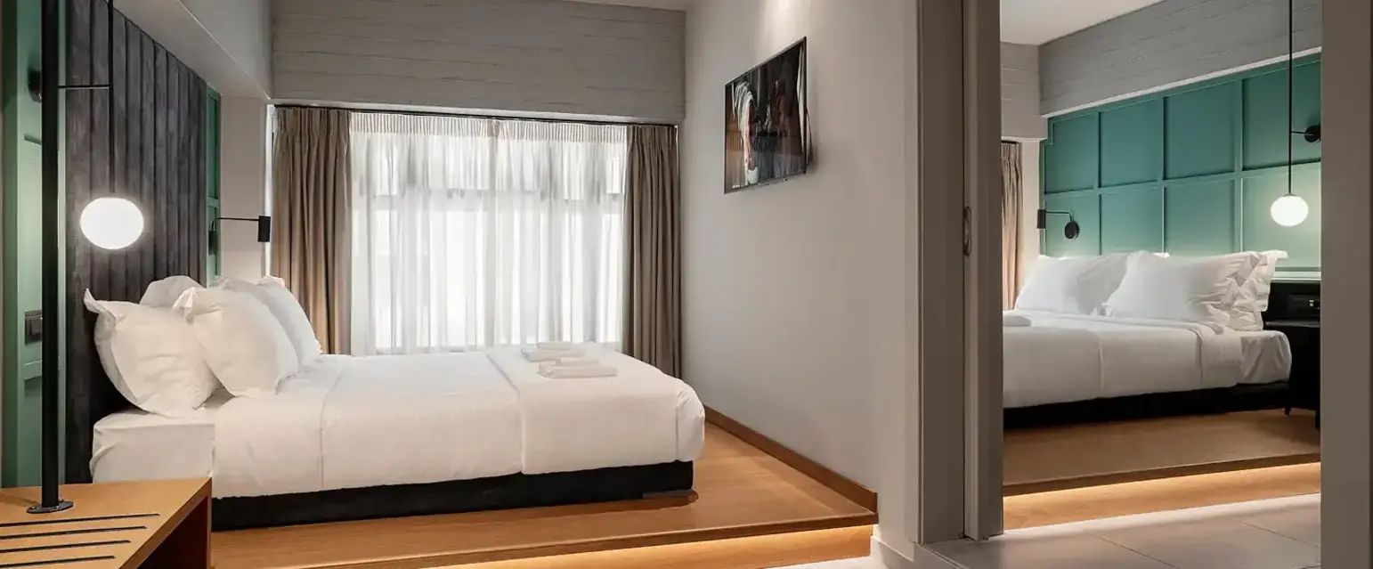 a bedroom with a mirror and a bed